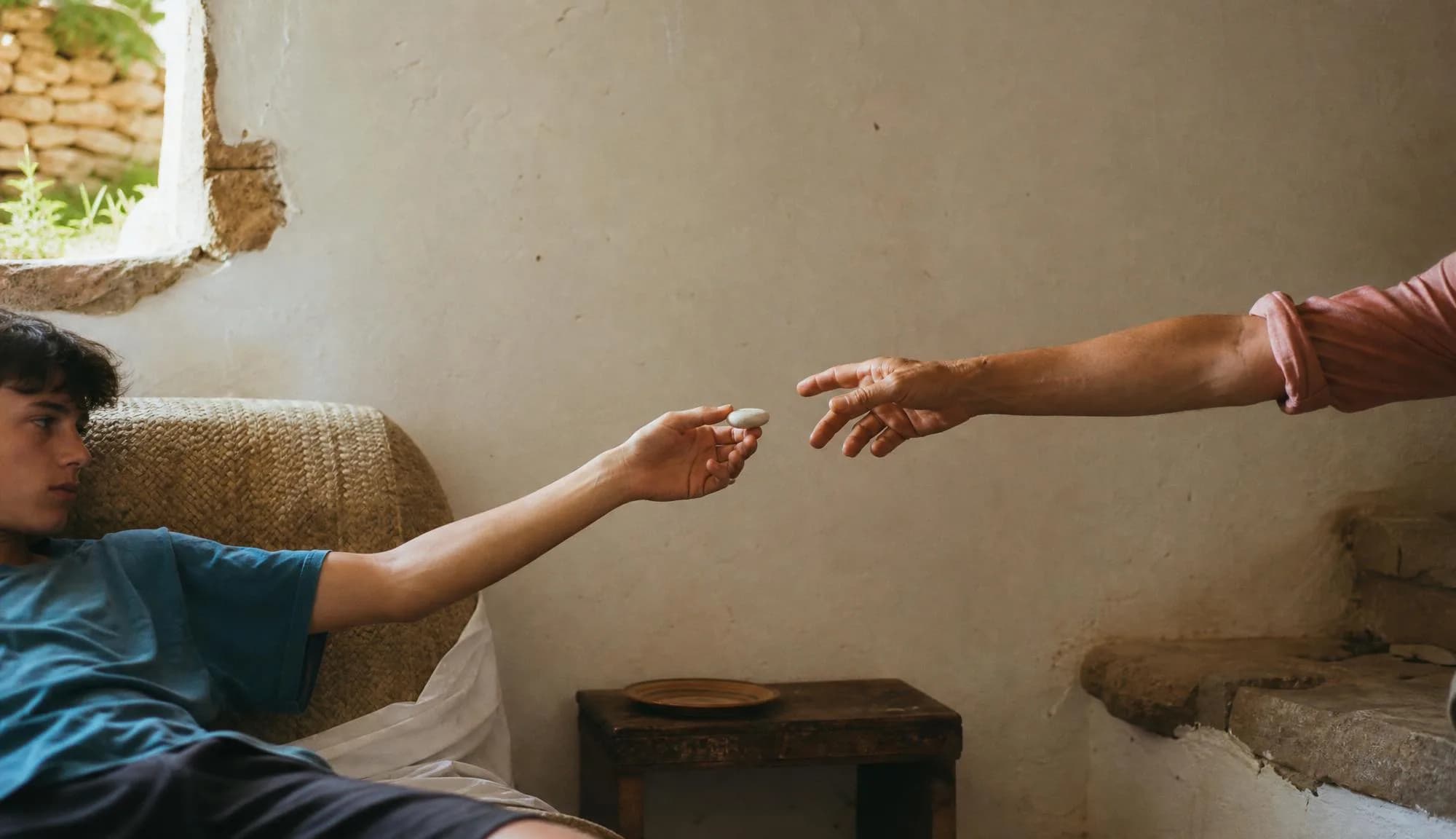 Outstretched hands passing the device across a warm interior.